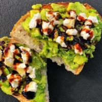 Avocado Toast  · Avocado, goat cheese, salt, and choice of seasoning and topping