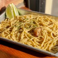 Garlic Noodles · Fresh noodles made in house. Fresh garlic is cooked in butter and mixed into the noodles wit...