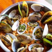 Seafood Jambalaya · A Cajun rice dish that consists of vegetables, shrimp, crab, sausage, mussel, and clam with ...