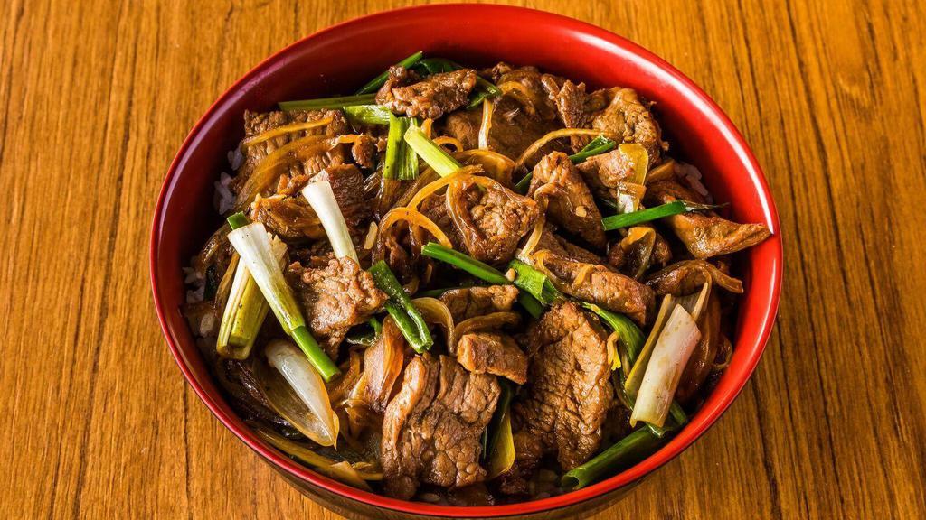 Mongolian Beef Bowl · Stir-fried slice Beef, Green onion, Yellow Onion served on top of rice bowl.