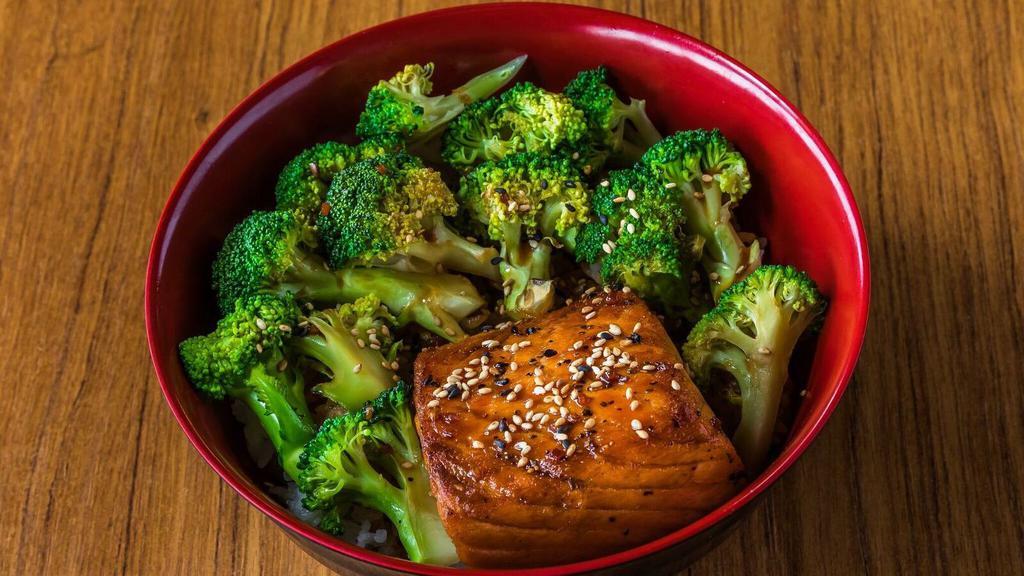 Teriyaki Salmon Bowl · Grilled Salmon steak, steam broccoli, Steam rice top with teriyaki sauce and sesame seeds.