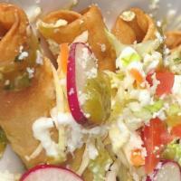 Taquitos Dorados · Hand Rolled Taquitos, Stuffed with Chicken & Potato, Cabbage, Tomatoes, Onions, Sour Cream, ...