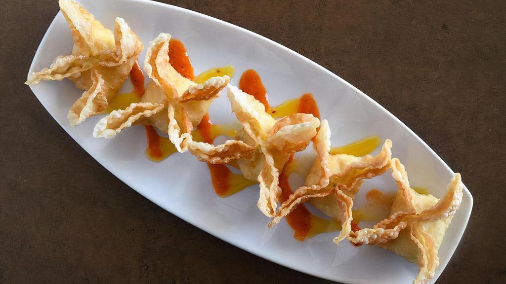 Mango Crab Rangoon · crispy wonton wrappers stuffed with crab mix, mango, cream cheese and scallion, served with mango and fresno pepper sauces. the seafood in this product carries an eco-certification