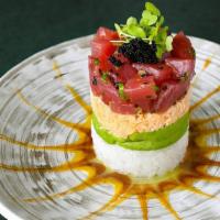 *Tuna Tower · sesame and ponzu-marinated bigeye tuna, spicy crab mix, avocado and sushi rice, topped with ...