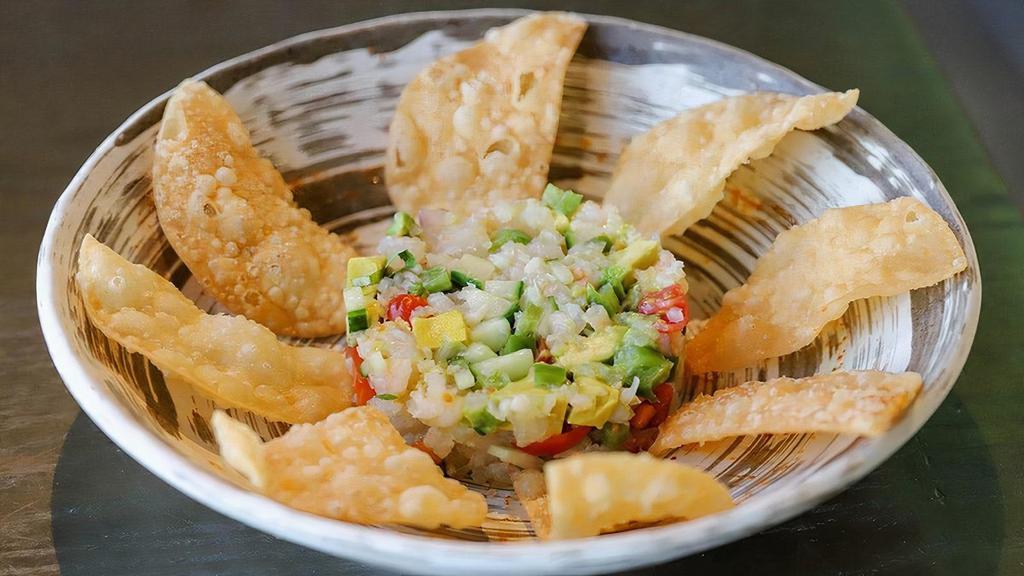 *Ceviche · tilapia, white shrimp, lime juice, cucumber, cherry tomato, avocado, cilantro, sweet onion, jalapeño salsa, wonton crisps, togarashi and chili oil. the seafood in this product carries an eco-certification