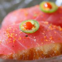 *Cherry Bomb · bigeye tuna on top of rice tempura, topped with serrano, sriracha, togarashi and ponzu sauce...