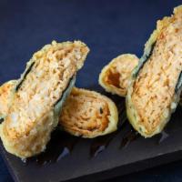 Blue Kani · tempura fried tofu pockets stuffed with spicy crab mix, served with eel sauce (4 pcs). the s...