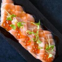 *Truffle Salmon (Gf) · atlantic salmon, drizzled with hot sesame oil, topped with ikura, truffle ponzu sauce and wa...