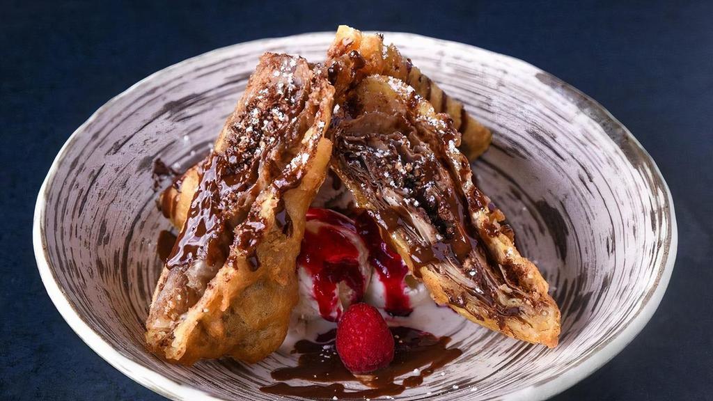 Chocolate Spring Rolls · crispy wonton wrappers stuffed with toasted cashew, cinnamon, raspberry purée and chocolate syrup, served with vanilla ice cream