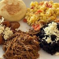 Criollo Breakfast · Sautéed eggs with onions and tomatoes, shredded beef, black beans, and one arepa.. enjoy :)