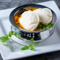 Sambar Idli (2 Pcs) · Sambar yellow lentils dal based vegetable. Served with two idlis. The cakes are made by stea...