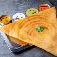 Onion Dosa · Rice crepe made with fermented urad dal and rice batter. Served with dipping chutney and sam...
