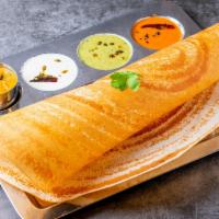 Plain Dosa · Rice crepe made with fermented urad dal and rice batter. Served with dipping chutney and sam...