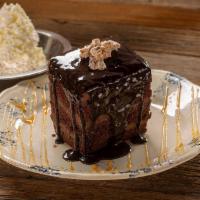 Chocolate Blackout Cake · chocolate sauce, spiced pecans, whipped cream