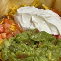 Taco Salad · Tortilla shell filled with crisp salad greens, tossed in southwest ranch dressing, topped wi...