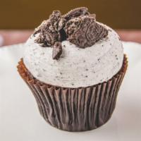 Chocolate Cookies & Cream Cupcake · Chocolate cupcake topped with our signature Oreo vanilla buttercream and Oreo pieces.