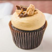 Peanut Butter Cup Cupcake · Chocolate cupcake topped with peanut butter cream cheese frosting and crumbled Reeses peanut...