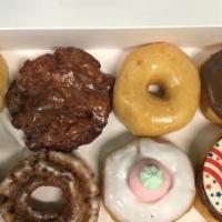 Dozen Of Mixed Donuts · 2 glazed,  2 chocolate donuts and a mixed of cakes, apple fritter, cinnamon roll, sprinkles....