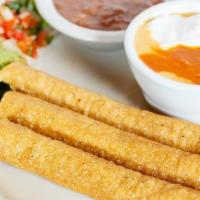 Flautas · Three lightly fried corn tortillas, rolled with seasoned chicken OR beef, served with fresh ...