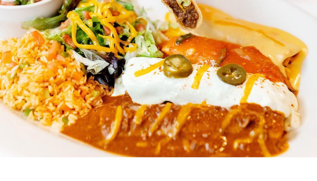 El Jefe · All your El Fenix favorites in one platter.  3 enchiladas (cheese with chile con queso, chicken with sour cream sauce, beef with chile con carne sauce), one beef tamale with ranchera sauce, one crispy beef taco, rice and refried beans