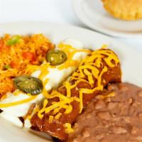 Maximilian’S Delight · one beef enchilada & one sour cream chicken enchilada & one puffed crispy beef taco with gua...