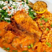 Tilapia Veracruz · Baked tilapia filet, topped with traditional ranchero sauce, served with sautéed spinach, ri...