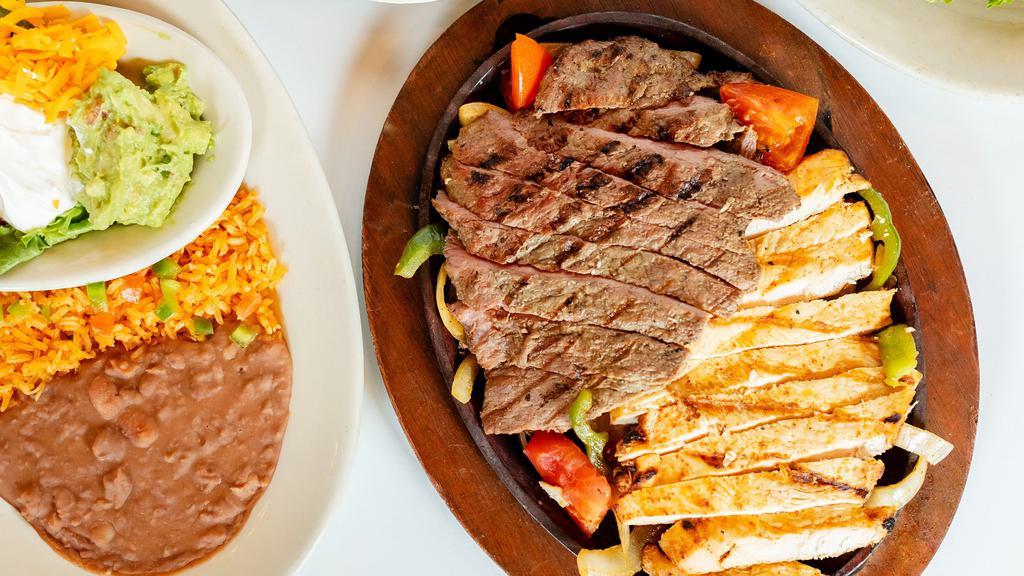 Fajita'S For 4 · 1 dozen2 lbs of Meat with bell peppers, onions, 1 dozen tortillas, refried beans, rice, salsa and chips with queso, fresh-made guacamole, sour cream & pico de gallo, aged cheddar cheese, salsa & your choice of flour or corn tortillastortillas, refried beans, rice, salsa and chips with queso, fresh-made guacamole, sour cream & pico de gallo, aged cheddar cheese, salsa & your choice of flour or corn tortillas