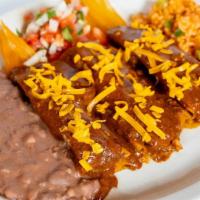Beef Tamale Family Pack · 8 Beef or Pork Tamales. Served with Rice, Refried Beans, Salsa, Queso, Guacamole and Chips