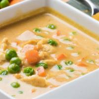 Yellow Curry · Curry with an aroma of cardamom, cinnamon, and turmeric with peas and carrots in coconut milk.