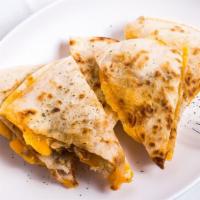 Quesadillas · Your choice of meat with American and monterrey jack cheese in between two flour tortillas. ...