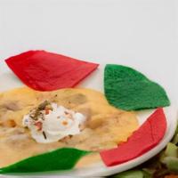 Cinco Ranas Dip · Five layer dip with refried beans, cheese, ground beef, sour cream and chile con queso.
