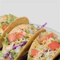 Crispy Tacos · Three corn tortillas with your choice of ground beef or shredded chicken with crisp lettuce,...