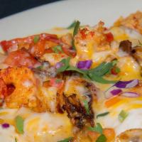 Seafood Enchiladas · Three cheese enchiladas topped with sautéed shrimp, crawfish, mushrooms and bell peppers wit...