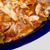 Chicken Enchiladas · Three shredded chicken enchiladas topped with sour cream sauce and melted cheese.