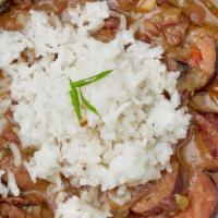 Red Beans, Rice And Sausage (Andouille) · Perfectly hearty Louisiana style comfort food. Slow cooked red beans, andouille sausage, Caj...