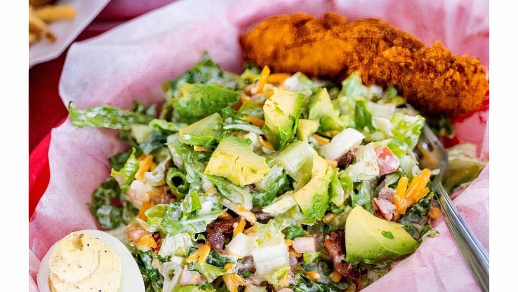 Half Cobb Salad · Hot Chicken Tender, Romaine, Deviled Eggs, Avocado, Tomato, Bacon, Cheddar Cheese, Hard Boiled egg and Ranch.