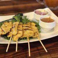 Chicken Satay (4) · Grill curry marinated chicken skewers served with thai peanut sauce and cucumber sauce.