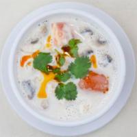 Tom Kha Soup · Mild spicy. Mushrooms, tomatoes with galangal root, lemongrass, lime juice and coconut milk....