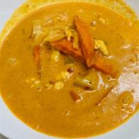 Yellow Curry · Mild spicy. Potatoes, tomatoes, onion and bell peppers in coconut milk. Served with steamed ...