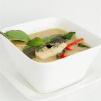 Green Curry · Mild spicy. Bamboo shoots, zucchini, bell peppers and fresh basil leaves in coconut milk. Se...