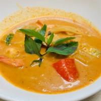 Red Curry · Mild spicy. Bamboo shoots, bell peppers and fresh basil leaves in coconut milk. Served with ...