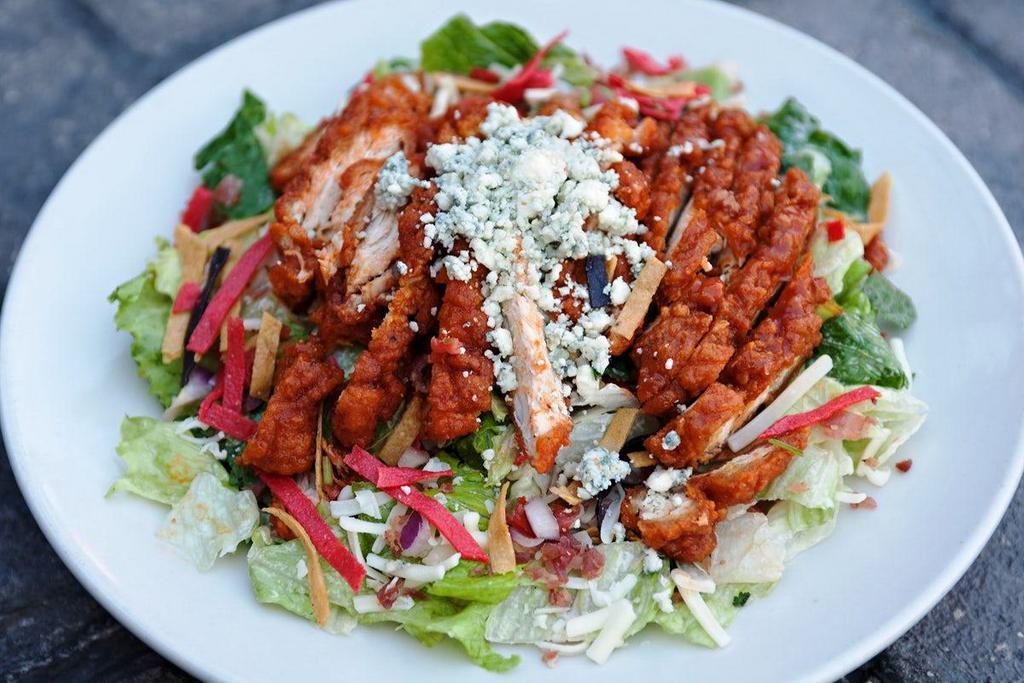 Buffalo Chicken Salad · grilled or fried chicken, wing sauce, fresh greens, bacon, white cheddar, pico de gallo, tortilla strips, crumbled bleu, chipotle ranch (salad dressing served on the side)