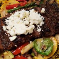 Sirloin Steak Power Grain Bowl · cajun spice, power grain rice, grilled vegetable medley, crumbled feta