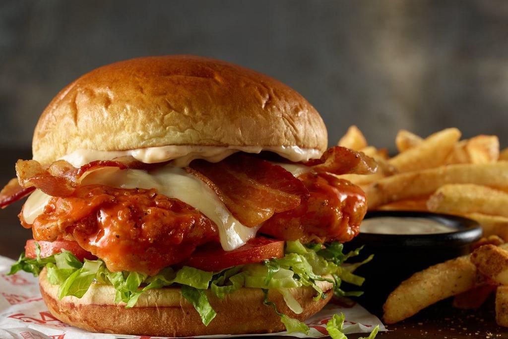 Spicy Fried Chicken · fried chicken (dressed in wing sauce or simply crispy), carolina reaper cheese, bacon, lettuce, pickle, smoky spread, standard side (buttermilk ranch or creamy bleu cheese)