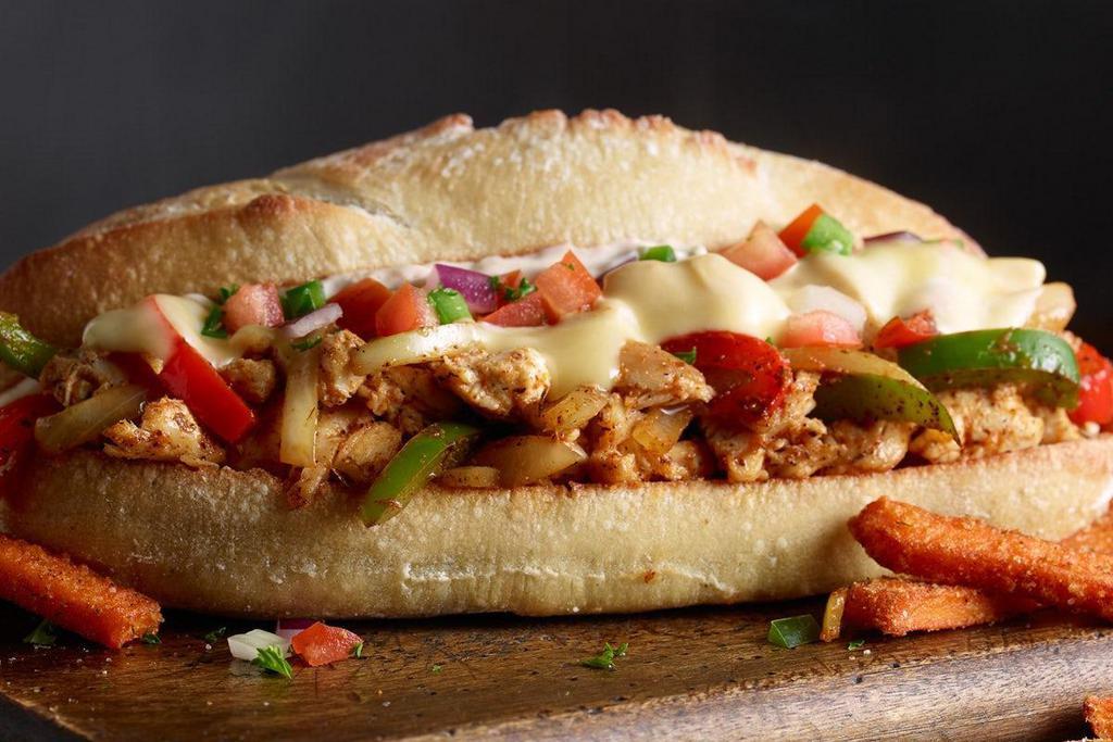Cajun Chicken Philly · chopped chicken, cajun spice, pepper, onion, chipotle mayo, smoked gouda, baguette, standard side
