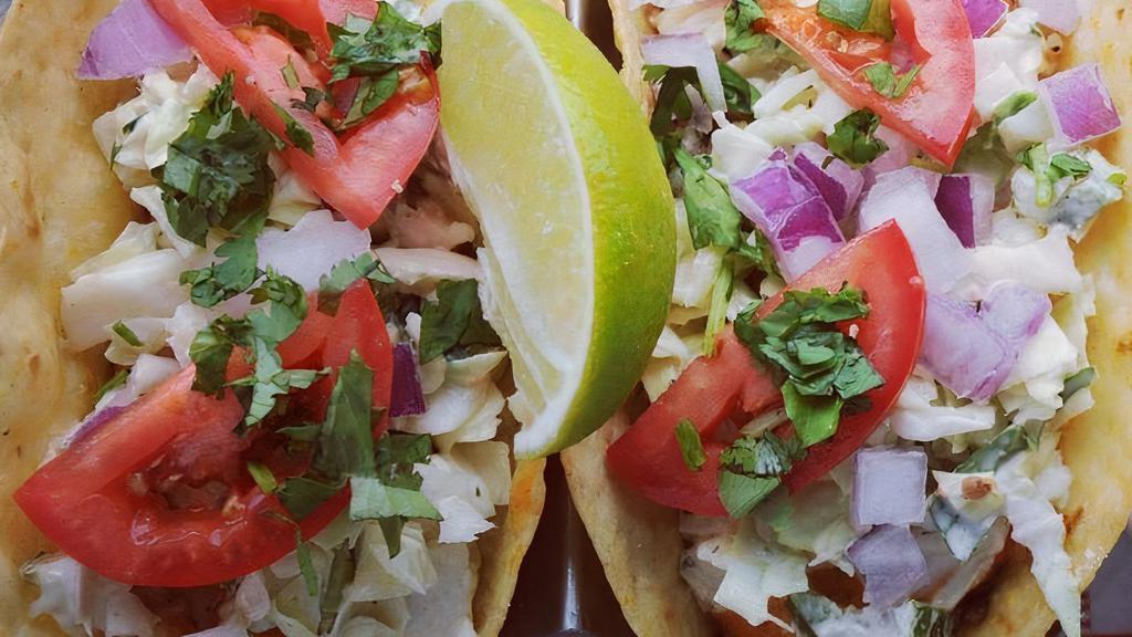 Pacific Fish Tacos Platter · grilled or fried white fish, dressed slaw, tomato, cilantro, cotija, corn-flour tortillas, red pepper sauce, mexican rice, refried beans.