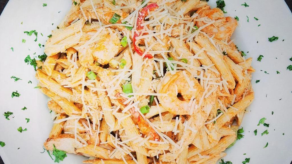 Rattlesnake Pasta · chicken, shrimp, pasta, parmesan cream sauce, red + green pepper, scallion, parmesan, garlic bread