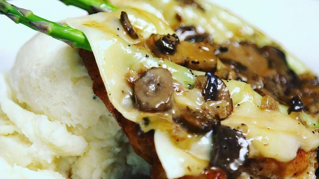 Chicken Madeira · “pan fried” chicken breast, mashed potatoes, asparagus, melted monterey jack, housemade mushroom madeira sauce