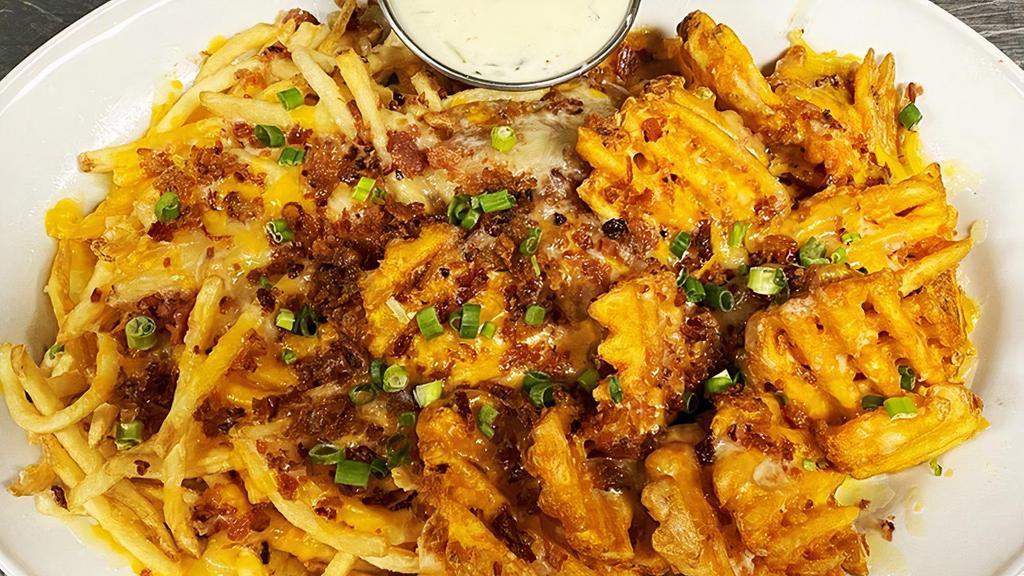 Fry Me To The Moon · fries, waffle fries, cheddar, bacon, scallion (gringo dip or chipotle ranch)