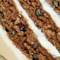 Colossal Carrot Cake · traditionally spiced, grated carrot, pineapple, walnut, pistachio, shaved coconut, real crea...